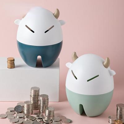 China Modern Plastic Cute Cow Coin Bank Year Of Savings Toy Decoration Ox Cartoon Children Piggy Bank Crafts Gift for sale