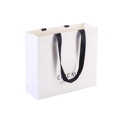 China Recyclable Hot Selling Custom White Shopping Paper Bag For Clothing Gift Takeaway Packaging Paper Bags for sale