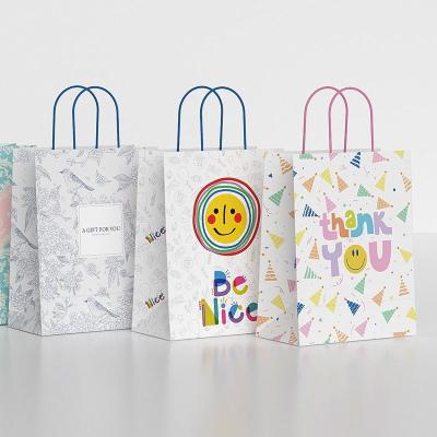 China Logotipo de impresión personalizado de Navidad Bolsas de compras de papel Kraft con asas en venta