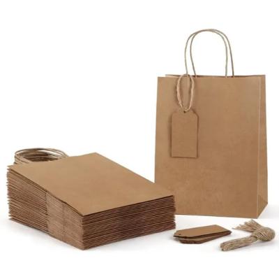 China Custom Logo Brown Kraft Paper Bags Reusable Kraft Packaging Bag With Handles for sale