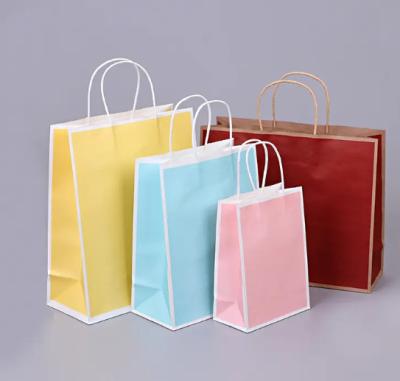 China Bolsas de papel reutilizables de logotipo personalizado Bolsas de papel de boutique para tiendas minoristas con mango en venta