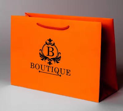 China Reusable Boutique Paper Shopping Bags Custom Logo With Handle For Retail Business for sale