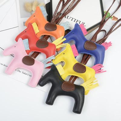 China Bonus Points For Gifts 16 Colors Luxury Handmade Leather Horse Key Chain PU Key Chain Women Bag Charm Pendant Accessories Horse Key Chain for sale