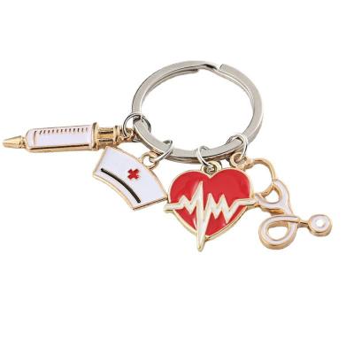 China Hot Cute Alloy Enamel Syringe Stethoscope Heart Keychain Doctor Nurses Medical Keychain Jewelry Gift for sale