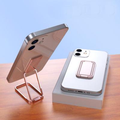 China Portable Adjustable Cell Phone Holder, Ring Buckle, Metal Invisible Desktop, Lazy Bracket, Magnetic Magic Ring Cell Phone Stand for sale