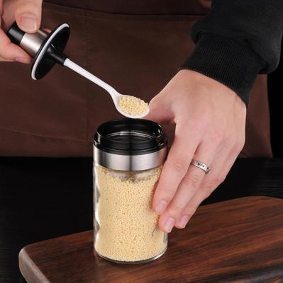 China Sustainable Non-slip Glass Spice Jars Seasoning Bottle With Spoon And Lid for sale