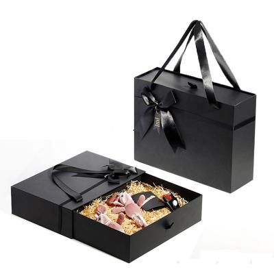 China Handmade Custom Design Luxury Cardboard Paper Perfume Packaging Business Shipping Flat Handle Gift Boxes for sale