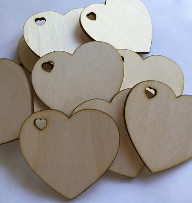 China Unfinished wooden hearts from Europe with heart shaped hole for wedding and parties for sale