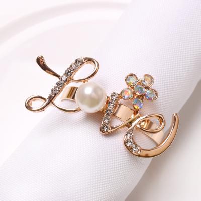 China New Stocked Banquet Party Wedding Dinner Occasions Gold Plated Crystal Pearl Love Servilleteros Napkin Rings Holder for sale