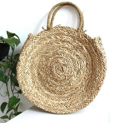 China ENGLAND STYLE 2021 New European and American Popular Women's Straw Beach Bag Round Bag Hands - Grass Woven Bag for sale