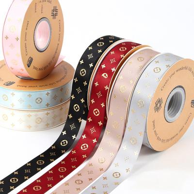 China Silk Screen Printed Polyester Satin Ribbon Other Packaging Products With Gold Foil Stamping Printing Te koop