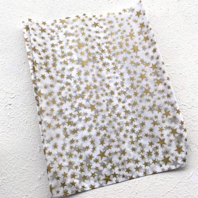 Cina Christmas Wrapping Paper Glossy Shiny Gold Stars Logo Printed Tissue Paper Packaging in vendita