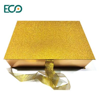 China Ready To Ship Regular Size Decorative Glittering Gold Finishing Luxury Square Gift Box With Ribbon And Magnetic Lid for sale