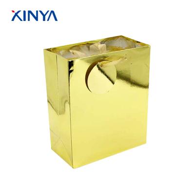 China Biodegradable custom printed different types of art paper gold hot-stamp paper gift bags for sale