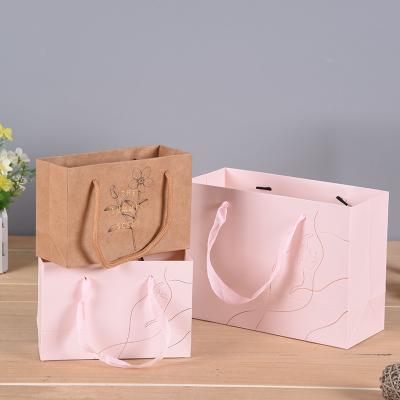 China Handmade Reliable Quality Luxury White Kraft Paper Bag for sale