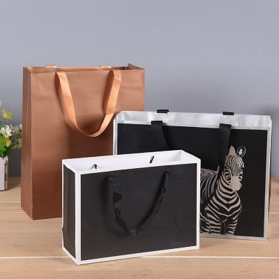 China Handmade Custom Printing Paper Bag Kraft Paper Gift Bag For Packaging for sale