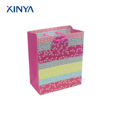 China Safety Custom Design Fancy Decorations Party Gift Packing Paper Bags Children New Year for sale