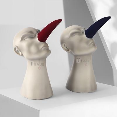 China Home Decor Art Creative Desktop Ornament Resin Cheap Red Sculpture Man Nose Abstract Europe Prices for sale