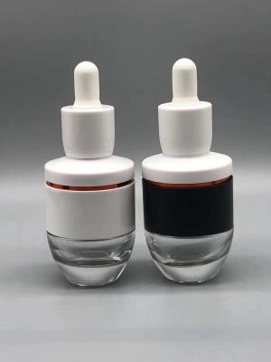 China Oem 30ml Cosmetic Boston Glass Bottles Amber UV Electroplating Durable Design for sale