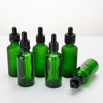 China botella cosmética de cristal verde transparente del dropper del suero 50ml para el suero en venta