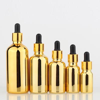 Chine L'huile cosmétique en verre vide en laiton d'or met la galvanoplastie en bouteille UV pour les huiles essentielles à vendre