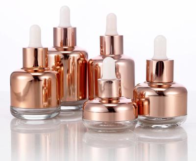 China Rose Gold Small Dropper Bottles 1Oz For Serum Cream Glass Makeup Containers for sale