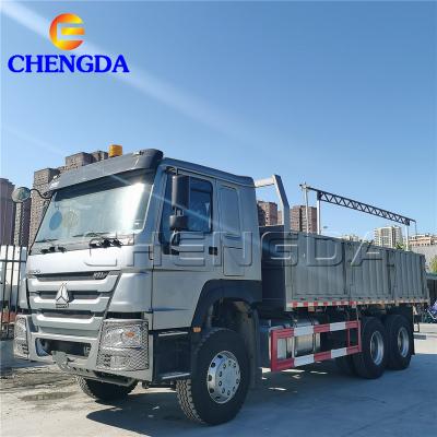 China SINOTRUK 6x4 RHD LHD 12200x2500x3600mm Cargo Truck Barrier Transport Flatbed Trucks for sale