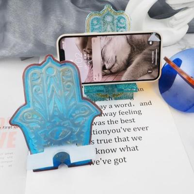 China Shiny T 470 Resin Hamsa Hand Phone Holder Mold Mobile Phone Holder Silicone Molds Disposable for sale