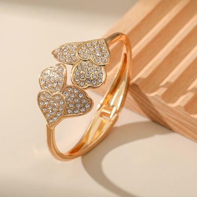 China 2022 Designer TRENDY Elegant 14K Gold Plated Crystal Rhinestone Beaded Heart Spring Open Charm Bracelet Women Jewelry for sale