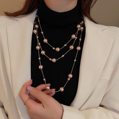 China Trendy Fashion Jewelry Trend Designer Imitations Elegant Double Row Pearl Sweater Chain Long Pearl Sweater Necklace For Women for sale