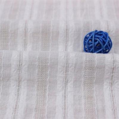 China Shrink-Resistant Jacquard Hollow Dots Stripe Cotton Fabric Yarn Dyed Soft Dobby Fabric For Dress for sale