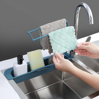 China Viable Kitchen Shelf Soap Sponge Draining Telescopic Folding Faucet Folding Plastic Sink Drain Basket for sale