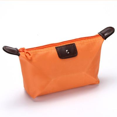 China NEW Fashion Reusable Makeup Bag Candy Color Folding Bag Ingot Nylon Type Storage Wash Bag for sale