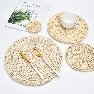 China Sustainable Wholesale Custom Natural Grass Round Place Mats Straw Place Mats For Kitchen Vintage Boho Style for sale