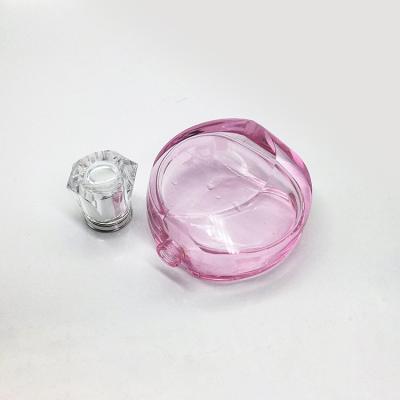 China Personal Care 100ml Round Shape Rose Color Diamond Perfume Glass Crystal Bottle For Women for sale