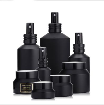 China Personal Care Black Flat Shoulder Serum Glass Bottle With Press Cap15g30g50g100g15ml30ml60ml100ml120ml200ml for sale