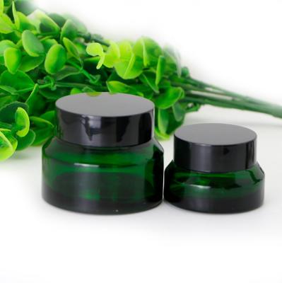 China Personal Care Luxury Slanted Shoulder Green Frosted Glass Bottle Cosmetic Jars for sale