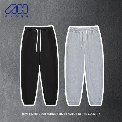 China 2023 New Fashion Men's Sports Pants 300g Solid Color Drawstring Breathable Running Pants Skin Friendly Breathable Sweatpants for sale