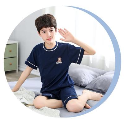 China Child Breathable Logo Sleepwear Set with Dark Blue Shirt and Pants Unisex Pajamas for sale