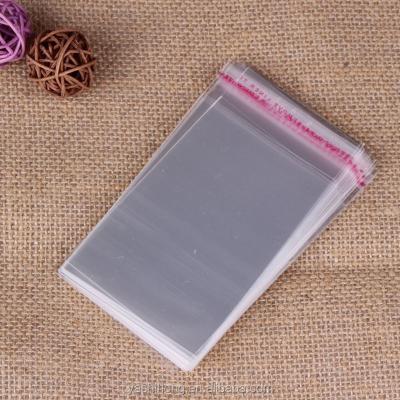 China Custom Size BIODEGRADABLE Clear Plastic Self Adhesive Poly Bag With Glue Strip For Grocery for sale