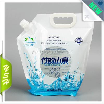 China Factory wholesale china moisture proof transparent window stand up spout liquid packaging pouch with plastic handle for sale