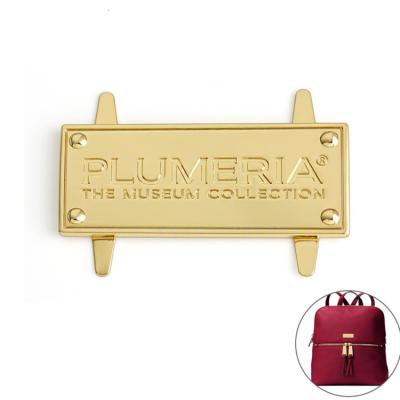 China China cheap price custom raised metal gold plated handbag logo plate pin nameplate for sale