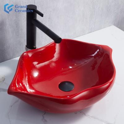 China Modern Wholesale Modern Bathroom Red Lips Shape Art Ceramic Wash Basin for Kitchen and Hotel for sale