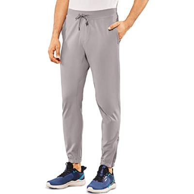 China Anti-Wrinkle Men Plain Golf Pants Dry Slim Fit Stretch Fabric Unisex Running Pants Spandex Band Drawstring Zipper Cuff Sweatpants for sale