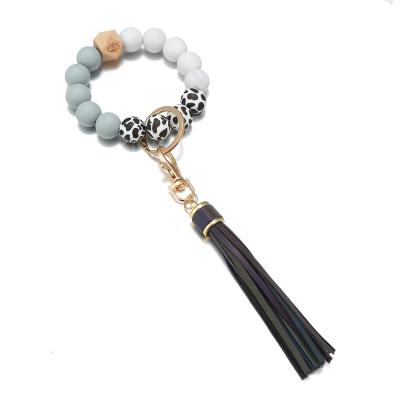 China FASHIONABLE Hot Selling Amazone New Arrival Silicone Bead Wood Beads Bracelet Key Chain Anti-lost Key Chain Key Rings for sale