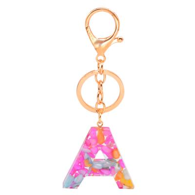 China Resin And Metal Young Ladies Gold Plated Resin 26 Letter Chains English Alphabet Key Chain For Bag Decoration for sale