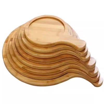 China Food Grade Hot Sale Wooden Design Soild Stored 100% Bamboo Round Pizza Serving Tray Dish Plate With Handle for sale