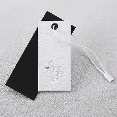 China Sustainable High End Custom Hang Tag For Apparel Own Logo Embossed Gold With GirlsJeans Trendy Hang Tag for sale