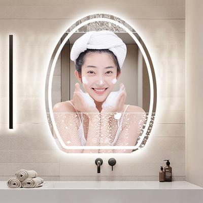 China Water Proof Drogging Moisture Proof Frameless Frontal Transmittance Led Touch Screen Smart Wall Mounted Mirror Demister Egg Shape Led Dressing Table Lighted Mirror for sale