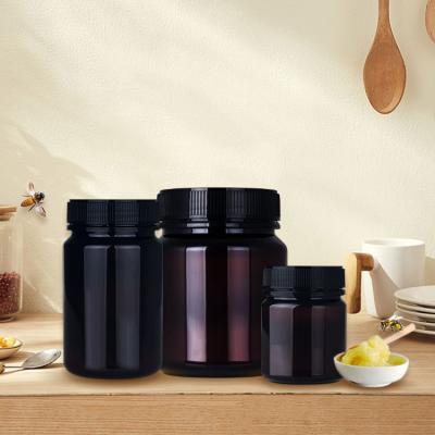 China 750ml 350ml 200ml Food Grade Amber Plastic Empty Jars For Honey for sale